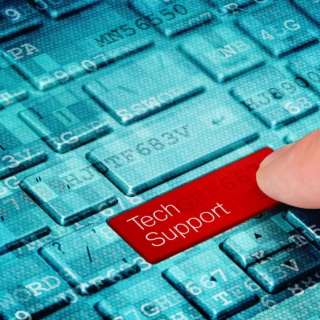 A finger press red ... button on blue digital laptop keyboard